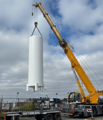 18,000-gallon vertical LNG tank lifted by crane